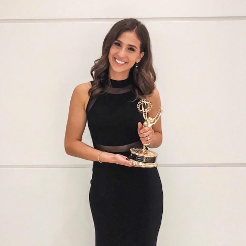Angie holding her Emmy Award, 2018
