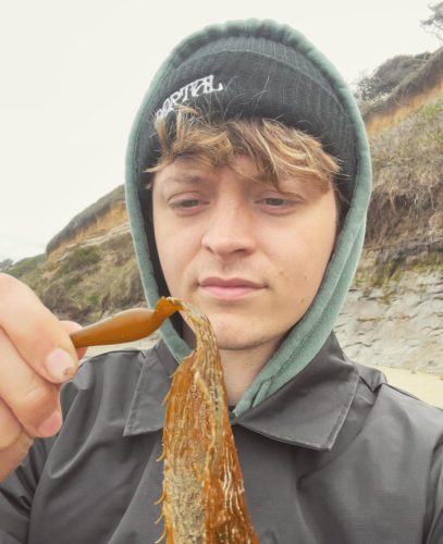 Jacob Colvin eating a seaweed