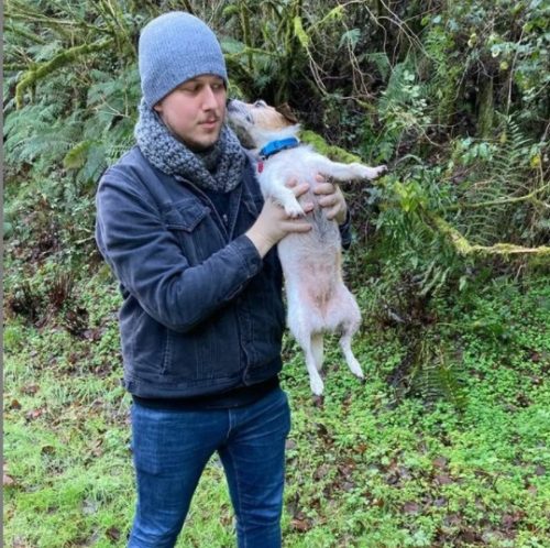 Chris O'Neill holding a pup