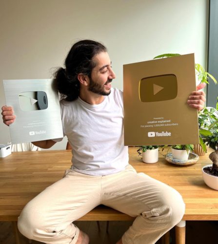 Armen Adamjan showing his golden and silver play button