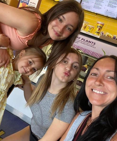 Allie with her mom and sisters