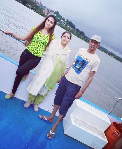 Anjum Khan with her parents