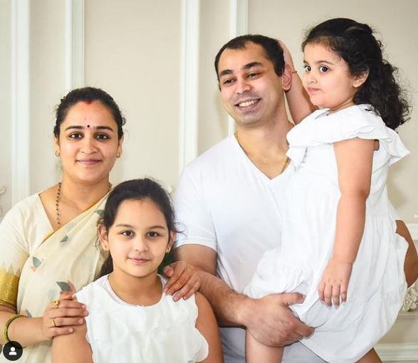 Aparna Yadav with her spouse and daughters