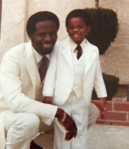 Breon Ansley old image with his dad