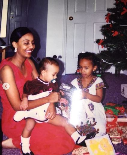Childhood photo of Rubi with her mom and sister