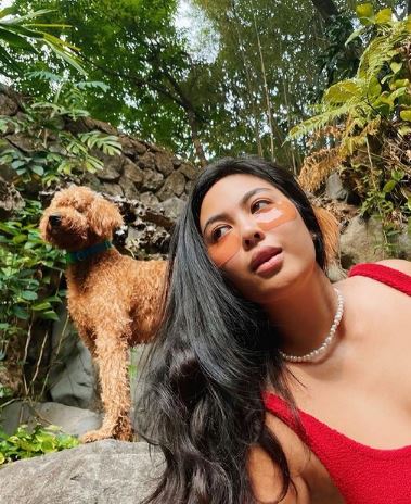 Dominique Cojuangco with her pet dog Chapo