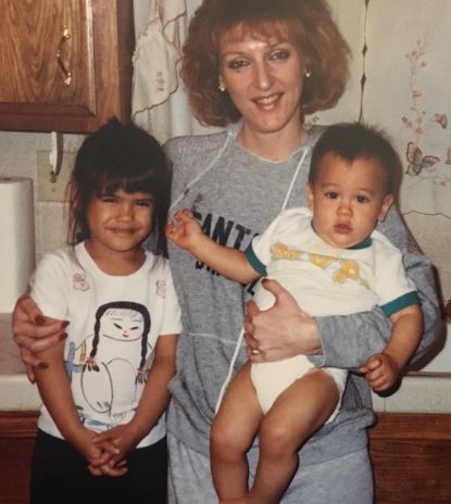 Young Jesiree with her mom and brother